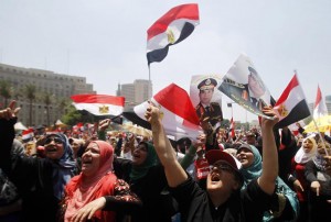 Protesters, who are against former President Mohamed Mursi, shout slogans during a rally at Tahrir square in Cairo