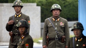 North Korean soldiers watch south at the truce village of Panmunjom