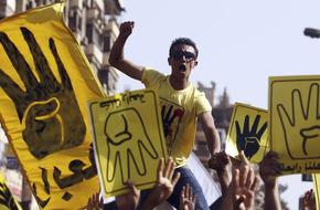 A member of the Muslim Brotherhood and supporter of ousted Egyptian President Mursi shouts slogans during a protest in Cairo