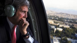 U.S. Secretary of State Kerry looks out of a black hawk helicopter en route to the ISAF headquarters in Kabul