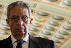 Arab League Secretary-General Amr Moussa attends a news conference in Cairo