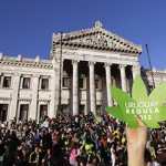 People participate in the so-called "Last demonstration with illegal marijuana" in front of the Congress building in Montevideo