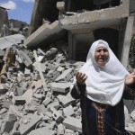 A Palestinian woman reacts in front of  the remains of her house, which police said was destroyed in an Israeli air strike, in Rafah in the southern Gaza Strip