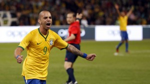 Brazil's Tardelli celebrates after scoring a first goal against Argentina during the international friendly soccer match titled "The Super Classic of the Americas", at the National Stadium in Beijing