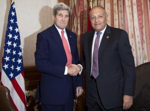 U.S. Secretary of State John Kerry shakes hands with Egypt's Foreign Minister Sameh Shoukry in Cairo