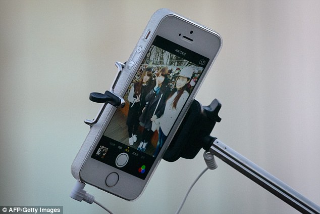 Eddie Lee, co-founder of Podo, said: 'You're no longer limited by the length of your arm or selfie stick (stock image). You can just stick it up anywhere you want and your hands are free to do whatever. Our mission is to connect people through pictures'