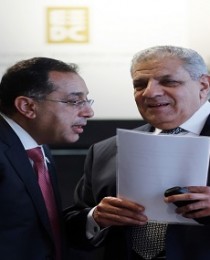 Egyptian Prime Minister Ibrahim Mehleb arrives with Housing Minister Mustafa Madbouly for the Egypt Economic Development Conference (EEDC) in Sharm el-Sheikh
