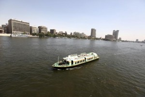 A boat cruises in the Egyptian Nile River in Cairo