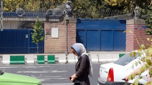An Iranian woman walks past the closed British embassy in the capital Tehran, on August 21, 2015. Britain and Iran will reopen their respective embassies in the coming days, according to an Iranian official, four years after protesters angry over nuclear sanctions stormed the UK mission in Tehran. AFP PHOTO / ATTA KENARE        (Photo credit should read ATTA KENARE/AFP/Getty Images)