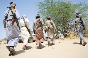 Armed Yemeni tribesmen from the Popular Resistance Committees, supporting forces loyal to Yemen's Saudi-backed President Abedrabbo Mansour Hadi, walk on the outskirts of Marib Dam in Marib province, east of the capital Sanaa, on October 1, 2015. Pro-Hadi forces who have set their sights on Sanaa made fresh gains in Marib province, east of Sanaa, capturing Marib dam and the surrounding hill, military sources said. AFP PHOTO / ABDULLAH HASSAN