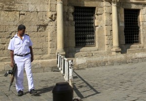 A policeman stands guard in front of a checkpoint at a popular tourist area in the Khan el-Khalili market, at al-Hussein and Al-Azhar districts in old Islamic Cairo, Egypt, November 12, 2015. Egypt's tourism revenue is a vital source of foreign currency in a country which has seen its foreign cash reserves dwindle sharply during years of political instability following the 2011 uprising which overthrew Hosni Mubarak. Last year, nearly 10 million tourists visited, far less than the 14.7 million in 2010. Officials had hoped for modest growth this year but the Sinai plane crash, coming at the start of the peak Red Sea winter holiday season, is likely to reverse that.  REUTERS/Amr Abdallah Dalsh