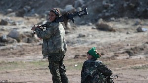 HOLE, SYRIA - NOVEMBER 10:  Kurdish female soldiers from the Syrian Democratic Forces take a break from frontline action at a forward operating base on November 10, 2015 near the ISIL-held town of Hole in the autonomous region of Rojava, Syria. The coalition of forces, primarily Kurdish, are attacking ISIL extremists in the area near the Iraqi border and calling in airstrikes from U.S.-led coalition warplanes. The autonomous region of Rojava in northern Syria has become a bulwark against the Islamic State. The Rojava armed forces, with the aid of U.S. airstrikes and weapons, are retaking territory which had earlier been captured much by ISIL from the Syrian regime.  (Photo by John Moore/Getty Images)