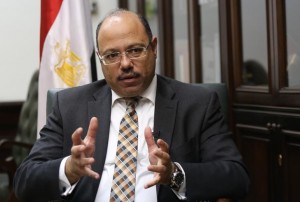 Egypt's Finance Minister Hany Kadry Dimian talks during an interview with Reuters at his office in Cairo, October 23, 2014. Egypt could tap international bond markets to raise up to $1.5 billion next year to shore up its finances and is open to agreeing an International Monetary Fund loan package if needed, Dimian said on Thursday. REUTERS/Mohamed Abd El Ghany (EGYPT - Tags: BUSINESS POLITICS)