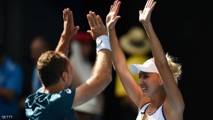 Elena Vesnina of Russia (R) and partner Bruno Soares of Brazil (L) celebrate their victory over Coco Vandeweghe of the US and Horia Tecau of Romania in the mixed doubles final on day 14 of the 2016 Australian Open tennis tournament in Melbourne on January 31, 2016.     AFP PHOTO / GREG WOOD -- IMAGE RESTRICTED TO EDITORIAL USE - STRICTLY NO COMMERCIAL USE / AFP / GREG WOOD        (Photo credit should read GREG WOOD/AFP/Getty Images)