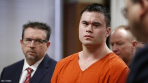 Former Oklahoma City police officer Daniel Holtzclaw (C), stands with his defense attorney Scott Adams (L), as his sentence is read during  hearing in Oklahoma City, Oklahoma, January 21, 2016. Holtzclaw who was convicted of raping four women and sexually assaulting several others while he was on duty, was sentenced Thursday to 263 years in prison, the maximum allowable.  REUTERS/Sue Ogrocki/Pool