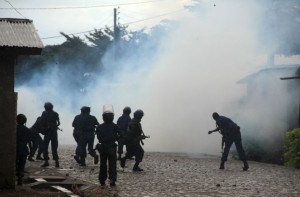 Riot policemen fire teargas at protesters as they clash during demonstrations against plans by Burundian President Pierre Nkurunziza to run for a third five-year term in office, in Bujumbura, May 8, 2015. Burundi's president registered on Friday to run for a third term, in a move likely to stoke anger among protesters opposing his bid for another five years in office. Crowds have taken to the streets of the capital and clashed with police for almost two weeks, saying Pierre Nkurunziza's plan to run again violates the constitution and a peace deal that ended an ethnically-charged civil war in 2005. REUTERS/Jean Pierre Aime Harerimana