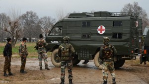 Indian army soldiers stand alongside an ambulance carrying the bodies of soldiers killed inside a army camp at Safapora some 20 kms (12 miles) from Srinagar on February 27, 2014. A soldier in Indian Kashmir shot dead five of his colleagues before killing himself, an incident which experts said highlights the stress facing troops in the volatile region bordering Pakistan. The soldier was on night duty when he opened fire on his colleagues who were reportedly sleeping in their barracks at a military camp, 20 kilometres (12 miles) north of the region's main city of Srinagar. AFP PHOTO/Tauseef MUSTAFA        (Photo credit should read TAUSEEF MUSTAFA/AFP/Getty Images)