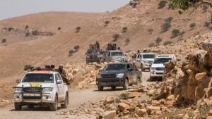 Kurdish People's Protection Units (YPG) fighters ride their vehicles on Abd al-Aziz mountain, Hasaka province, after they said they took control of the area May 20, 2015. Kurdish People's Protection Units (YPG) took control of Abd al-Aziz mountain from Islamic state fighters, after clashes that lasted for several days, activists said. Picture taken May 20, 2015. REUTERS/Rodi Said