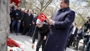 Turkish Prime Minister Ahmet Davutoglu (R) and his wife Sare Davutoglu leave carnations and a turkish flag to pay their respects to the victims at the terror attack's scene in Ankara, on March 17, 2016. A radical Kurdish group with ties to the outlawed Kurdistan Workers' Party (PKK) on Thursday claimed the deadly suicide car bomb attack that killed 35 people in Ankara on March 13, 2016. / AFP / UMIT BEKTAS        (Photo credit should read UMIT BEKTAS/AFP/Getty Images)