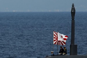 Officers stand aboard a Soryu submarine of the Japanese Maritime Self-Defense Force (JMSDF) during a fleet review at Sagami Bay, off Yokosuka, south of Tokyo in this October 15, 2015 file photo.  Japan has enlisted electronics firm Toshiba Corp to help it try to win Asia's biggest defense contract, a A$50 billion ($36 billion) deal to build a dozen submarines for Australia, three sources said.  REUTERS/Thomas Peter/Files