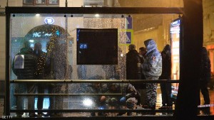 Russian police investigators inspect a damaged bus stop in a blast on Pokrovka street in centre Moscow late on December 7, 2015. An improvised explosive device went off on a bus stop in Moscow, three people injured. AFP PHOTO / NATALIA KOLESNIKOVA / AFP / NATALIA KOLESNIKOVA        (Photo credit should read NATALIA KOLESNIKOVA/AFP/Getty Images)