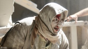 ATTENTION EDITORS - VISUAL COVERAGE OF SCENES OF INJURYAn injured woman reacts at a site hit by airstrikes in the rebel held area of Old Aleppo, Syria, April 28, 2016. REUTERS/Abdalrhman Ismail     TPX IMAGES OF THE DAY
